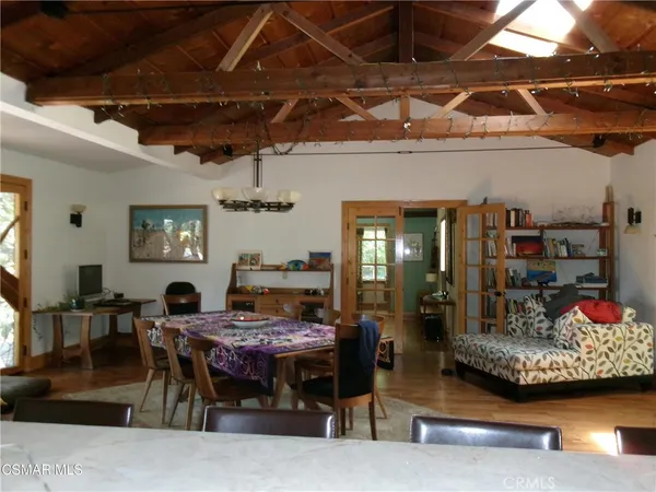 a work room with furniture and wooden floor