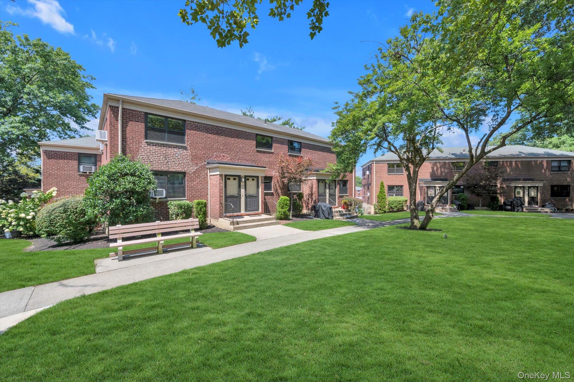 219-27 75th Avenue, Unit 2 Queens, NY 11364 - Photo 10 of 10 a view of a house with a yard