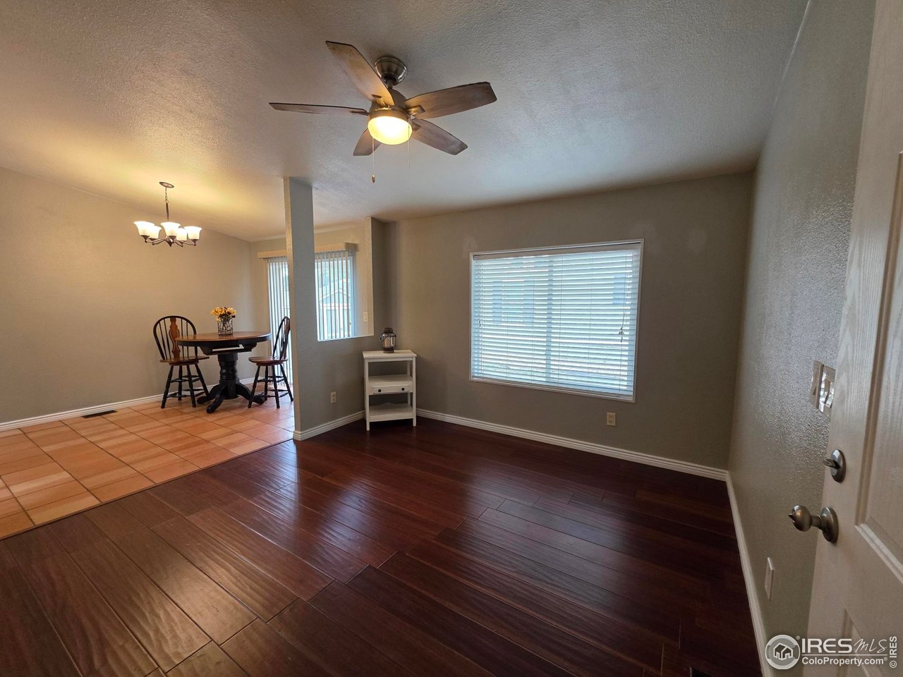 3272 North Rim, Unit 136 Longmont, CO 80504 - Photo 11 of 38 a view of a livingroom with furniture and a window