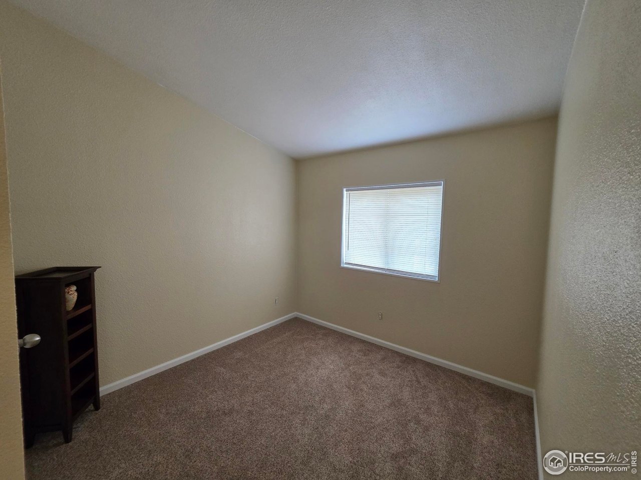 3272 North Rim, Unit 136 Longmont, CO 80504 - Photo 30 of 38 an empty room with a window