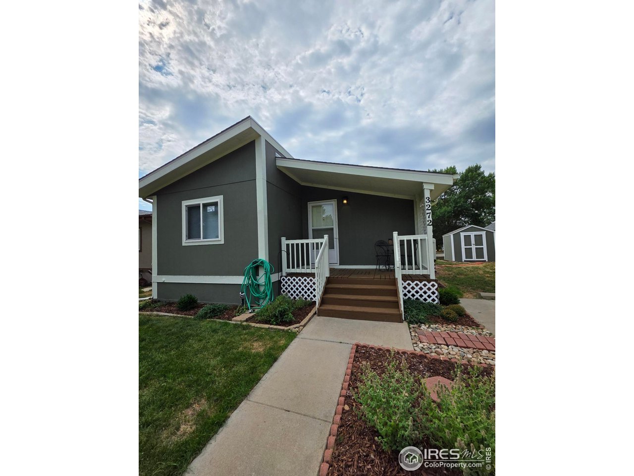3272 North Rim, Unit 136 Longmont, CO 80504 - Photo 4 of 38 a house view with a outdoor space