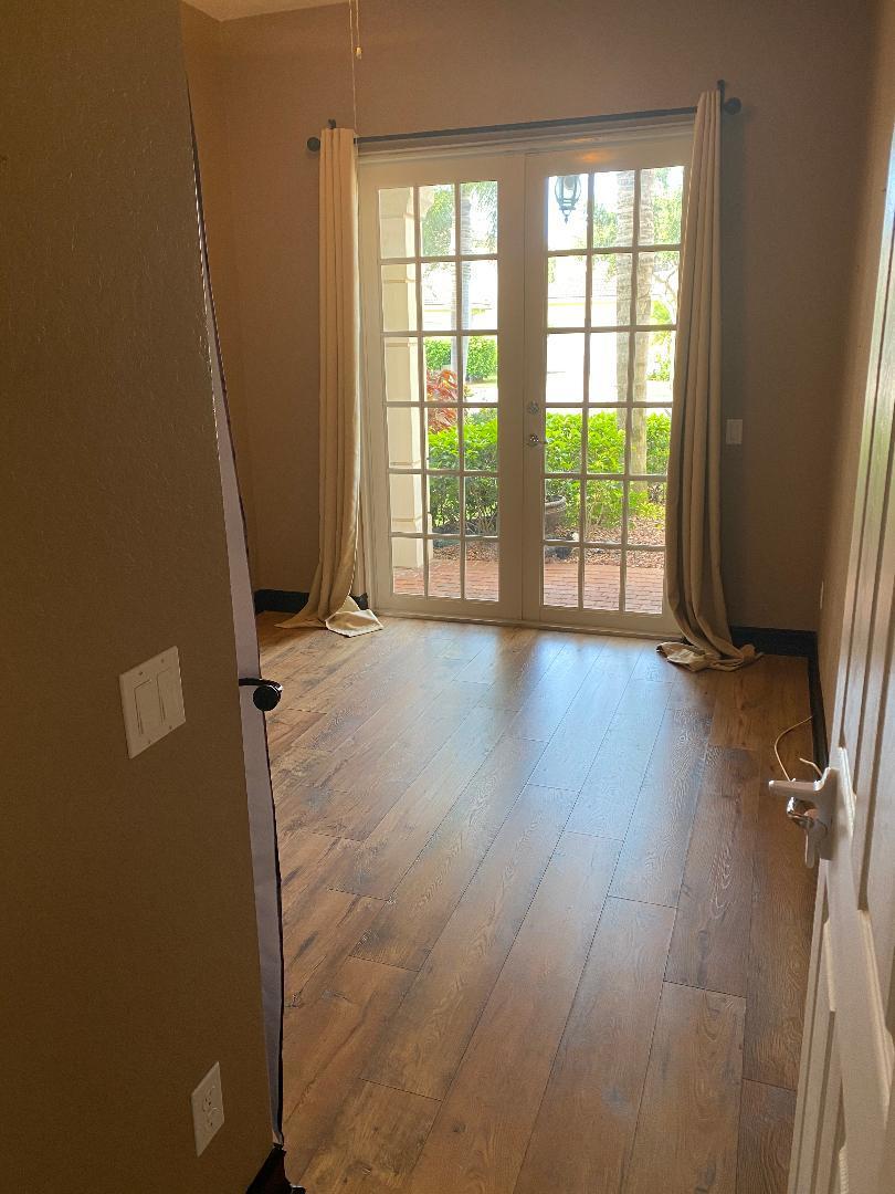7907 Emerald Winds Circle Boynton Beach, FL 33473 - Photo 13 of 39 a view of a room with wooden floor and a window