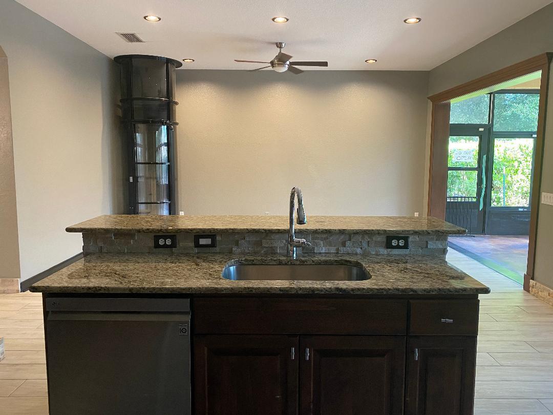 7907 Emerald Winds Circle Boynton Beach, FL 33473 - Photo 20 of 39 a bathroom with a granite countertop sink and a mirror
