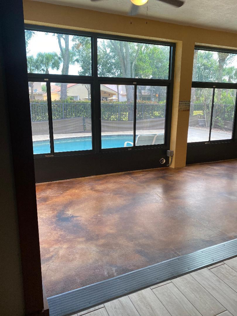 7907 Emerald Winds Circle Boynton Beach, FL 33473 - Photo 21 of 39 a view of empty room with wooden floor and windows