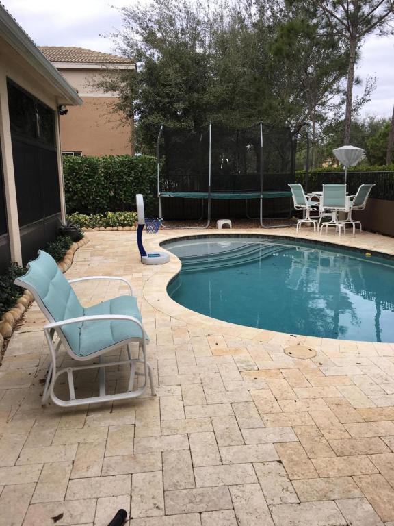 7907 Emerald Winds Circle Boynton Beach, FL 33473 - Photo 26 of 39 a view of swimming pool with chairs