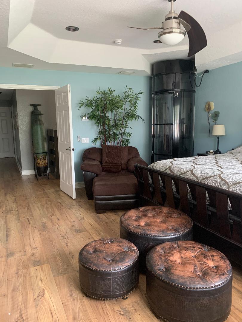 7907 Emerald Winds Circle Boynton Beach, FL 33473 - Photo 30 of 39 a living room with furniture and a fireplace