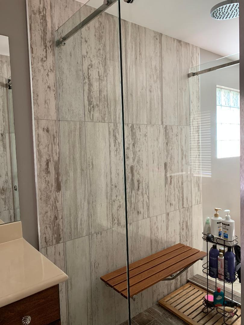 7907 Emerald Winds Circle Boynton Beach, FL 33473 - Photo 36 of 39 a bathroom with a shower and a sink