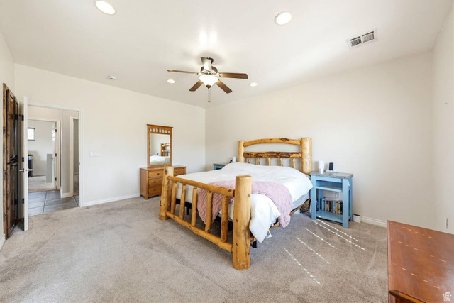 7776 Wagon Road East St. George, UT 84770 - Photo 21 of 76 Bedroom featuring light carpet, ceiling fan, and recessed lighting