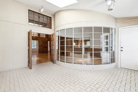 a view of an entryway with a door