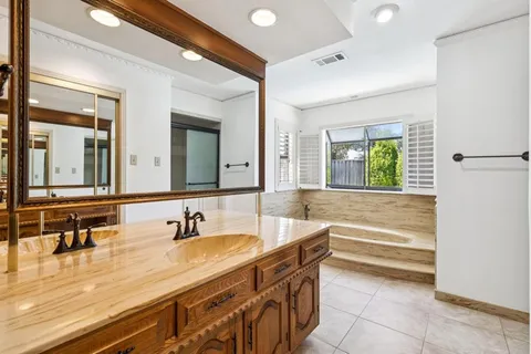 a view of a sink and a window