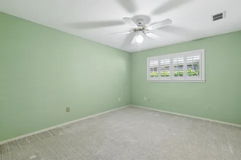 a bathroom with a sink double vanity and a mirror