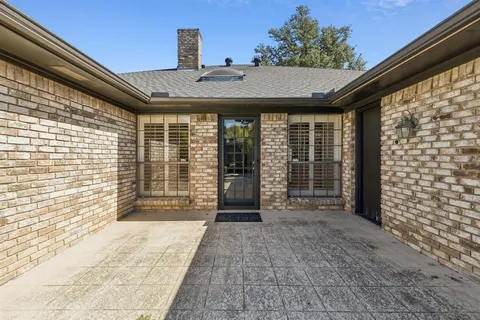 a spacious bathroom with a granite countertop sink and a mirror