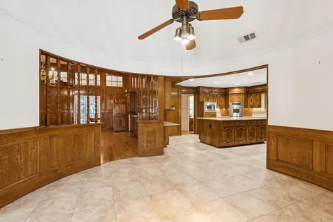 a view of a kitchen with a sink and cabinets