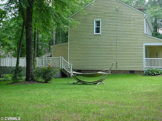 2518 Tanglebrook Road Midlothian, VA 23112 - Photo 4 of 12 a view of a backyard with a garden