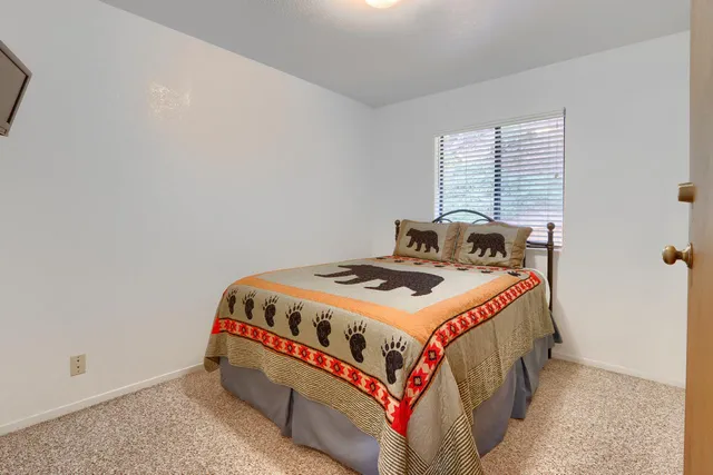 a room with a bed and a window