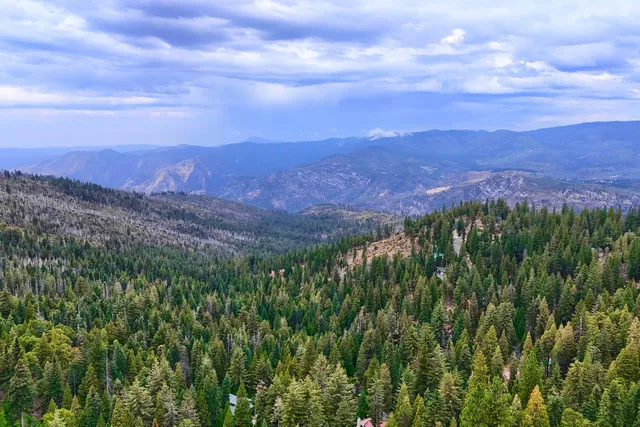 a view of a city with mountains in the background