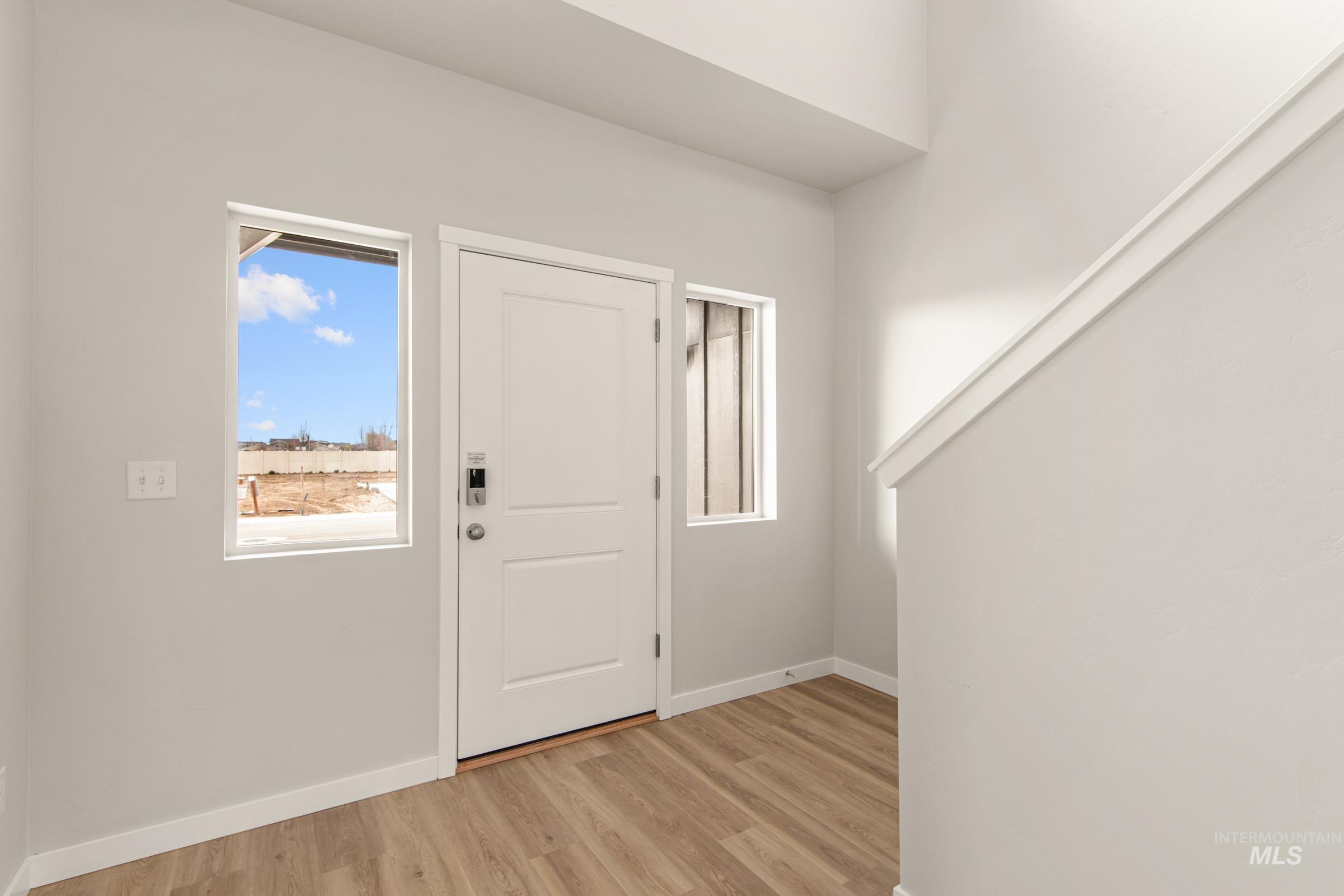 13688 Redway Court Caldwell, ID 83607 - Photo 2 of 26 Entryway featuring light wood finished floors and baseboards