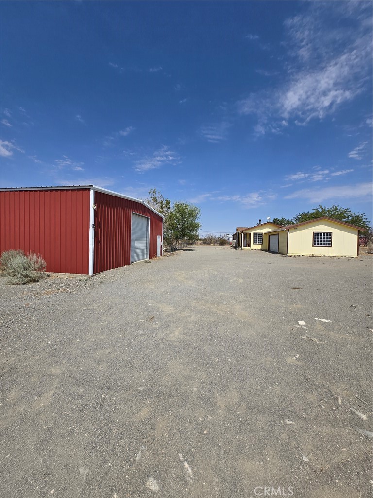12285 Golden View Road Pinon Hills, CA 92372 - Photo 1 of 21 a view of an outdoor space and a building