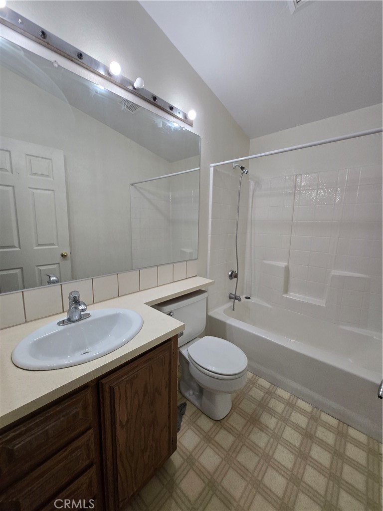 12285 Golden View Road Pinon Hills, CA 92372 - Photo 14 of 21 a bathroom with a sink a toilet a mirror and bathtub