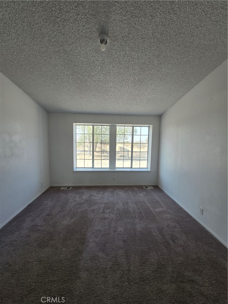 12285 Golden View Road Pinon Hills, CA 92372 - Photo 16 of 21 an empty room with a window