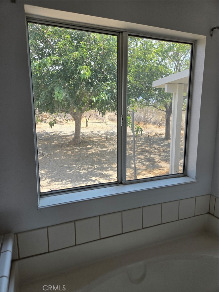12285 Golden View Road Pinon Hills, CA 92372 - Photo 18 of 21 a view of an empty room with a window