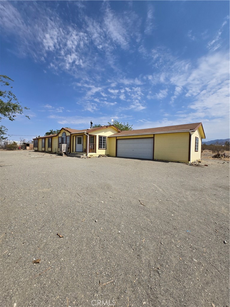 12285 Golden View Road Pinon Hills, CA 92372 - Photo 7 of 21 a view of an ocean with a building in the background