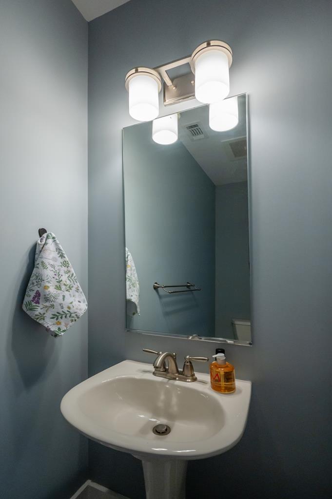 1201 Front Avenue, Unit 222 Columbus, GA 31901 - Photo 7 of 29 a bathroom with a sink and a mirror