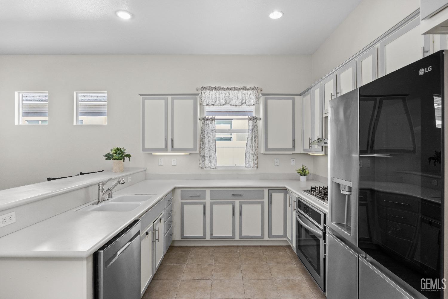 Undisclosed Address Bakersfield, CA 93306 - Photo 12 of 24 a kitchen with a sink stove and refrigerator