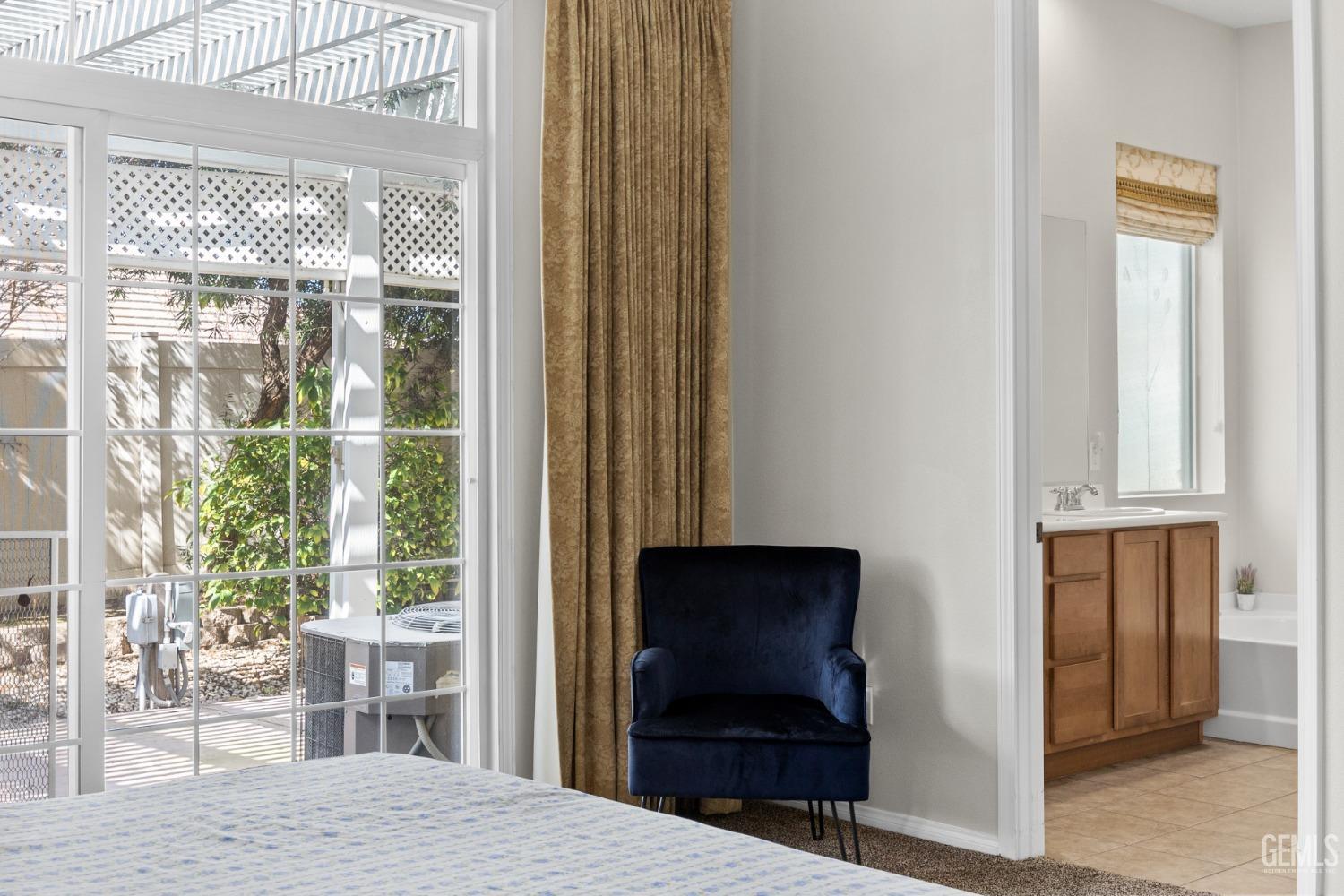 Undisclosed Address Bakersfield, CA 93306 - Photo 14 of 24 a bedroom with a bed and large window