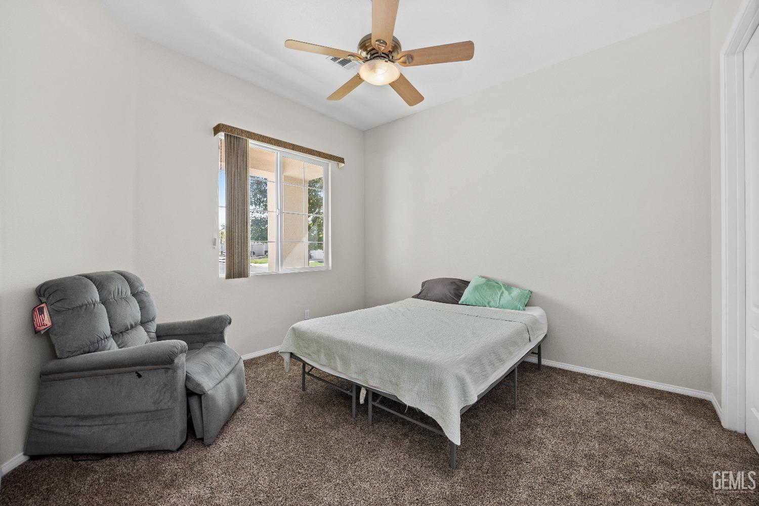 Undisclosed Address Bakersfield, CA 93306 - Photo 17 of 24 a bedroom with a bed and a couch