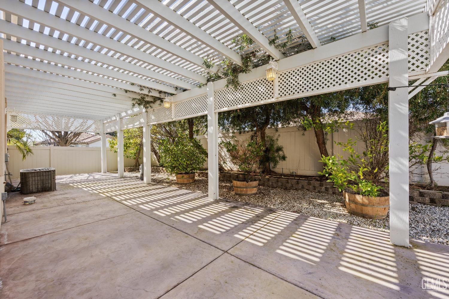 Undisclosed Address Bakersfield, CA 93306 - Photo 22 of 24 a view of a patio with table and chairs and wooden floor