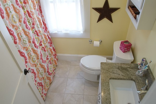 37 Kendall Road Lexington, MA 02421 - Photo 24 of 29 a bathroom with a toilet and a shower curtain