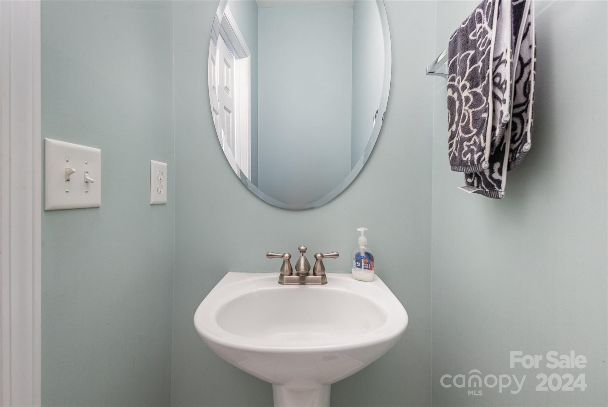 311 Wave Crest Drive Fort Mill, SC 29708 - Photo 12 of 45 a bathroom with a sink and a mirror