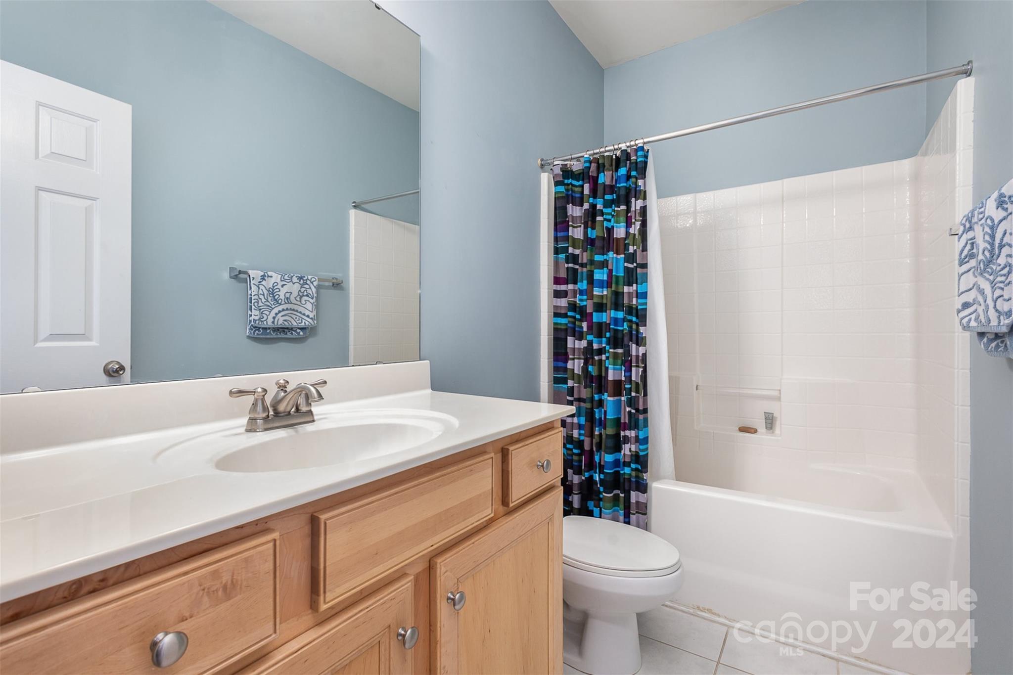 311 Wave Crest Drive Fort Mill, SC 29708 - Photo 19 of 45 a bathroom with a sink a toilet and shower