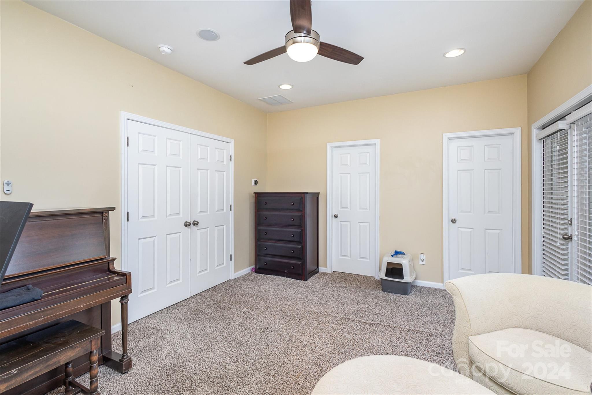 311 Wave Crest Drive Fort Mill, SC 29708 - Photo 22 of 45 a living room with furniture and a dresser