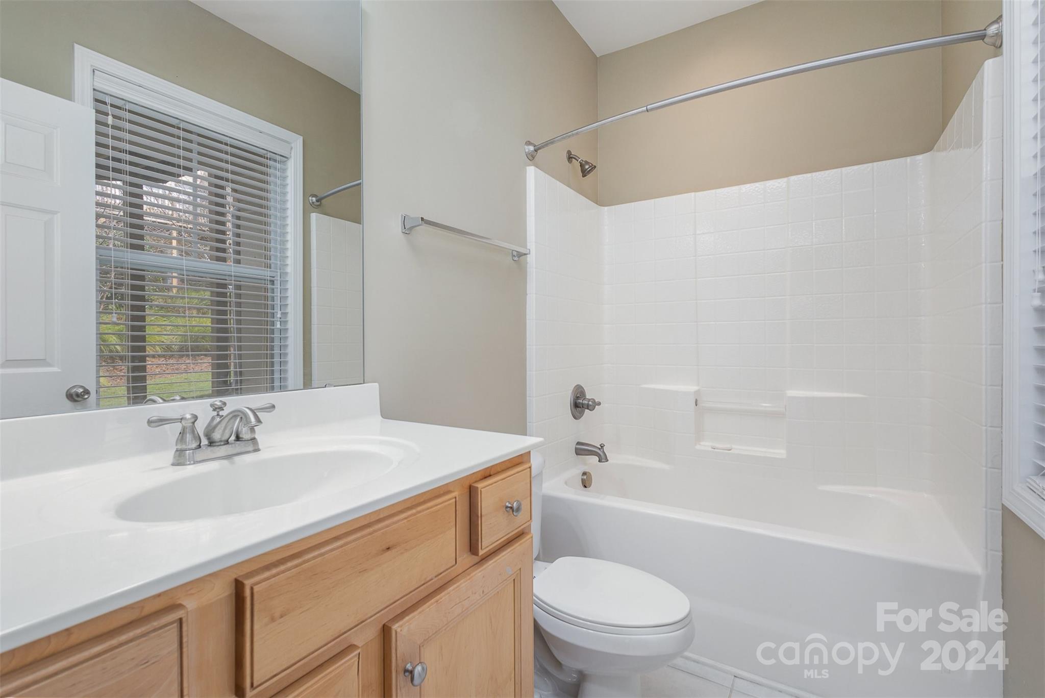 311 Wave Crest Drive Fort Mill, SC 29708 - Photo 23 of 45 a bathroom with a sink a toilet and shower