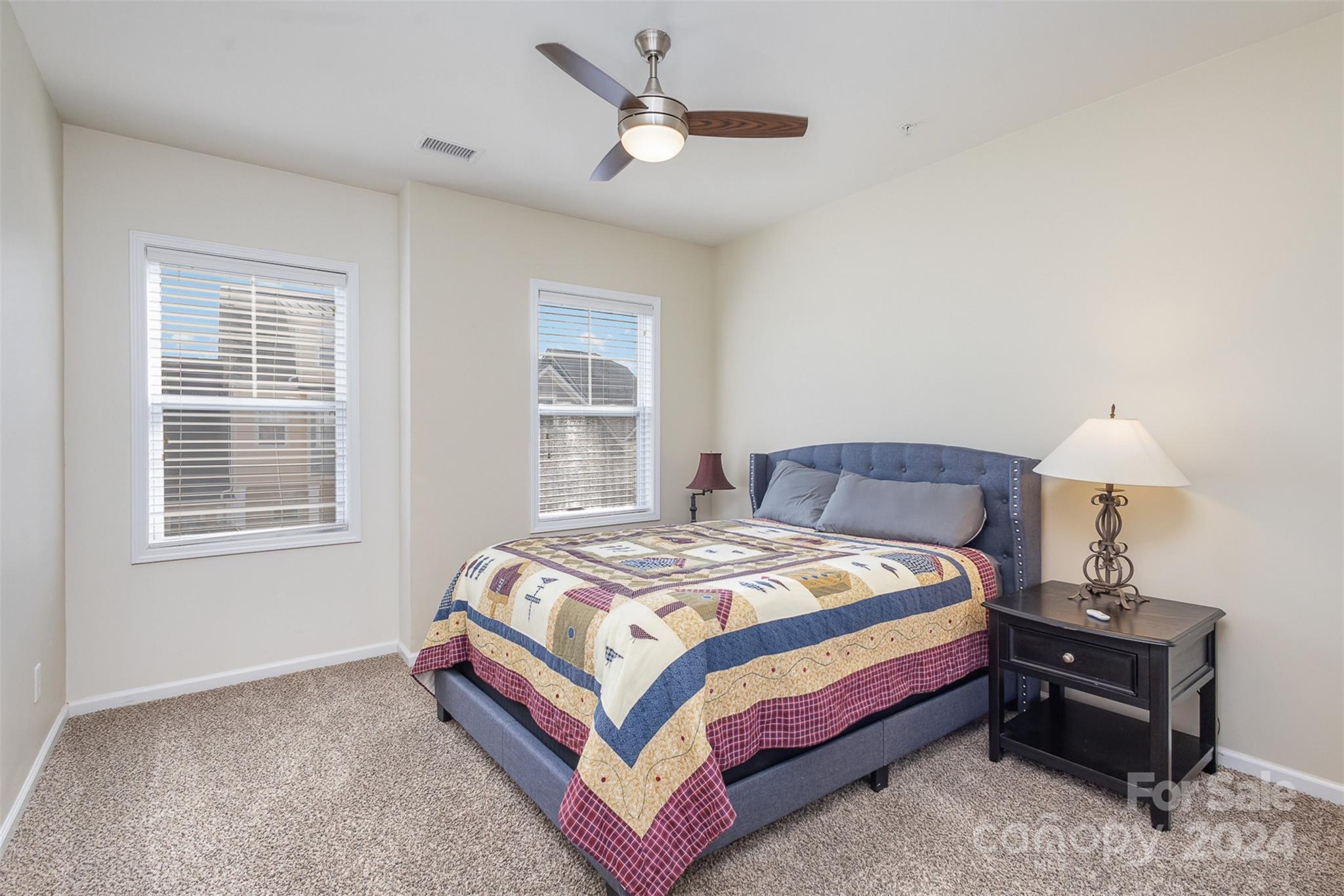 311 Wave Crest Drive Fort Mill, SC 29708 - Photo 24 of 45 a bedroom with a bed and a window
