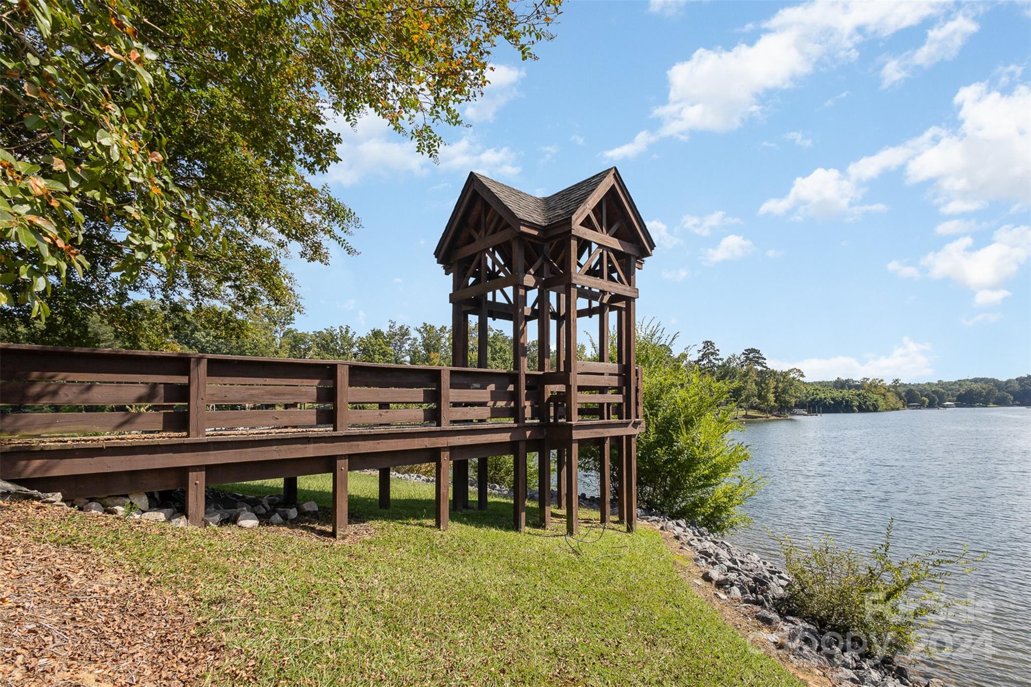 311 Wave Crest Drive Fort Mill, SC 29708 - Photo 39 of 45 a view of a lake with a house in the background