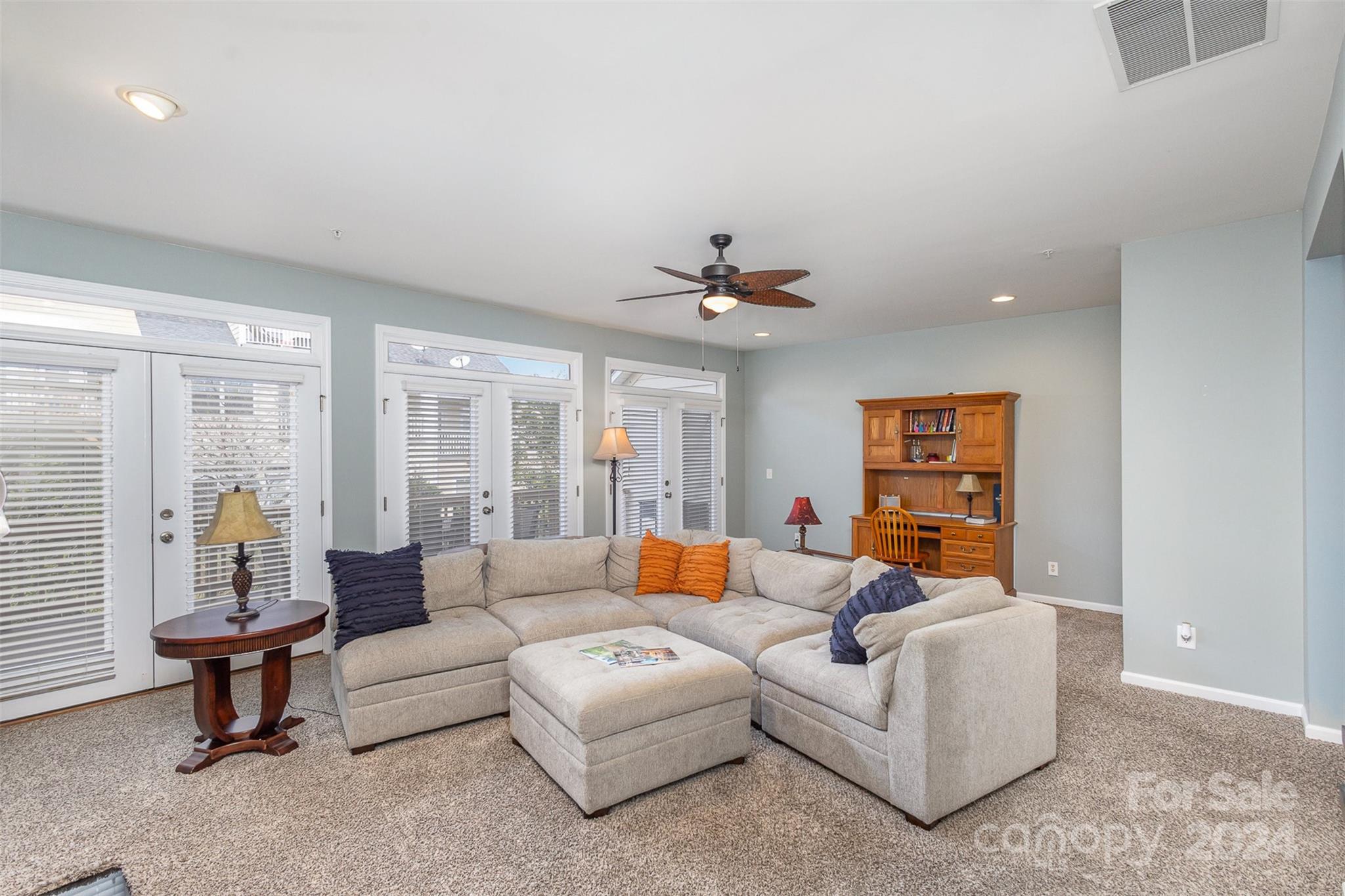 311 Wave Crest Drive Fort Mill, SC 29708 - Photo 5 of 45 a living room with furniture and a chandelier