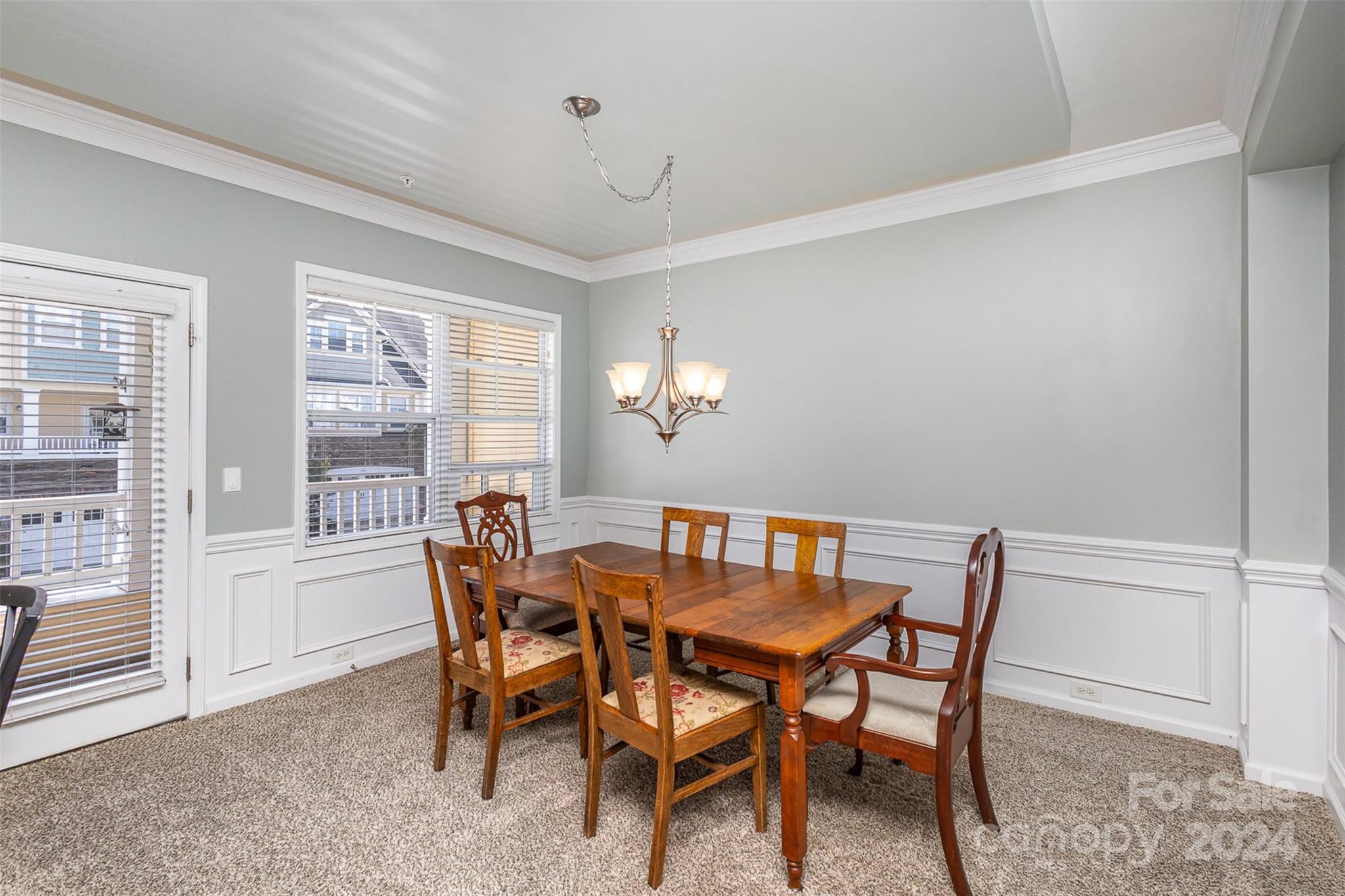 311 Wave Crest Drive Fort Mill, SC 29708 - Photo 7 of 45 a view of a dining room with furniture and a chandelier