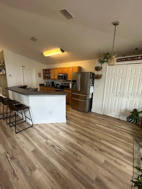 207 Tree Branch Lane Edgewater, FL 32141 - Photo 12 of 22 a kitchen with stainless steel appliances kitchen island granite countertop a refrigerator a stove and a sink with granite countertops
