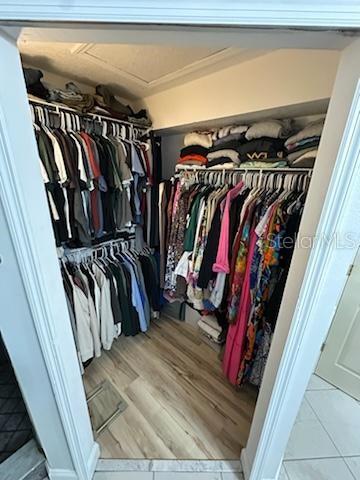 207 Tree Branch Lane Edgewater, FL 32141 - Photo 16 of 22 a view of walk in closet with clothes and shoes