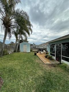 207 Tree Branch Lane Edgewater, FL 32141 - Photo 21 of 22 a view of a backyard with couches plants and large trees