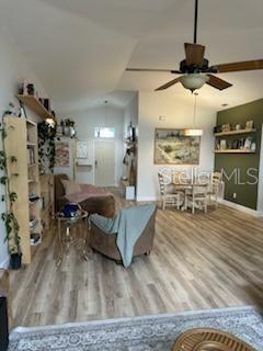 207 Tree Branch Lane Edgewater, FL 32141 - Photo 6 of 22 a living room with furniture and a wooden floor