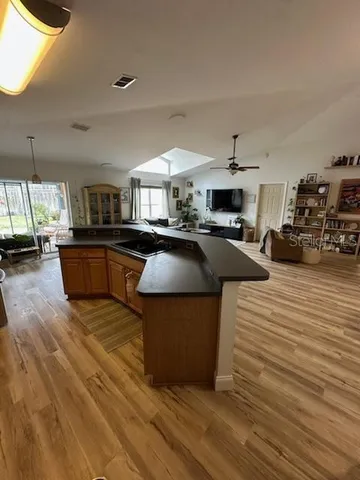 a kitchen with sink refrigerator and stove