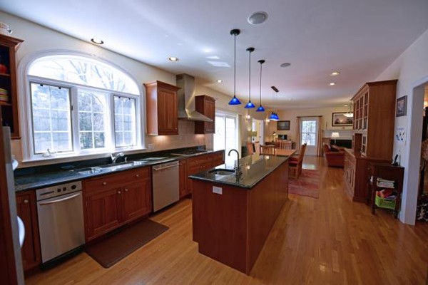 102 Argilla Road Andover, MA 01810 - Photo 14 of 30 a kitchen with stainless steel appliances granite countertop a sink a stove and a wooden floors