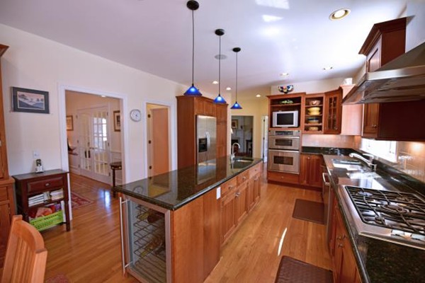 102 Argilla Road Andover, MA 01810 - Photo 16 of 30 a kitchen with stainless steel appliances granite countertop a stove and a wooden floors