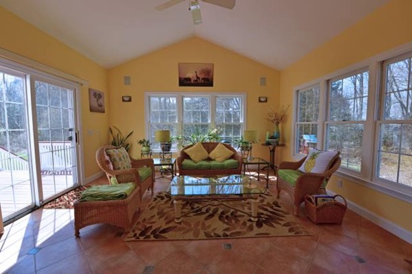 102 Argilla Road Andover, MA 01810 - Photo 19 of 30 a living room with furniture and a floor to ceiling window