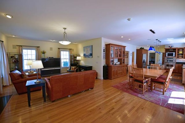 102 Argilla Road Andover, MA 01810 - Photo 20 of 30 a living room with furniture kitchen view and a wooden floor