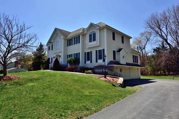 102 Argilla Road Andover, MA 01810 - Photo 2 of 30 a front view of a house with a yard